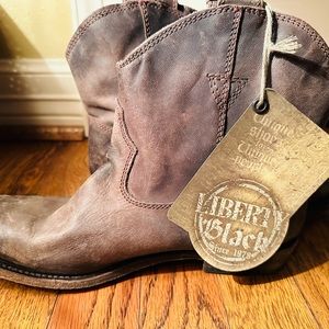 Brand new Liberty Black slip on boots.